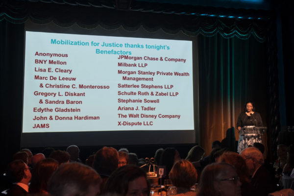 Event co-chair Kathy Card Beckles gets the festivities started by thanking event sponsors
