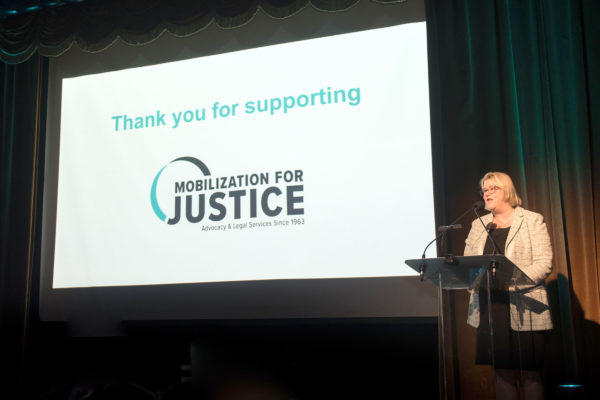 MFJ Board Chair Amy Starr begins the festivities